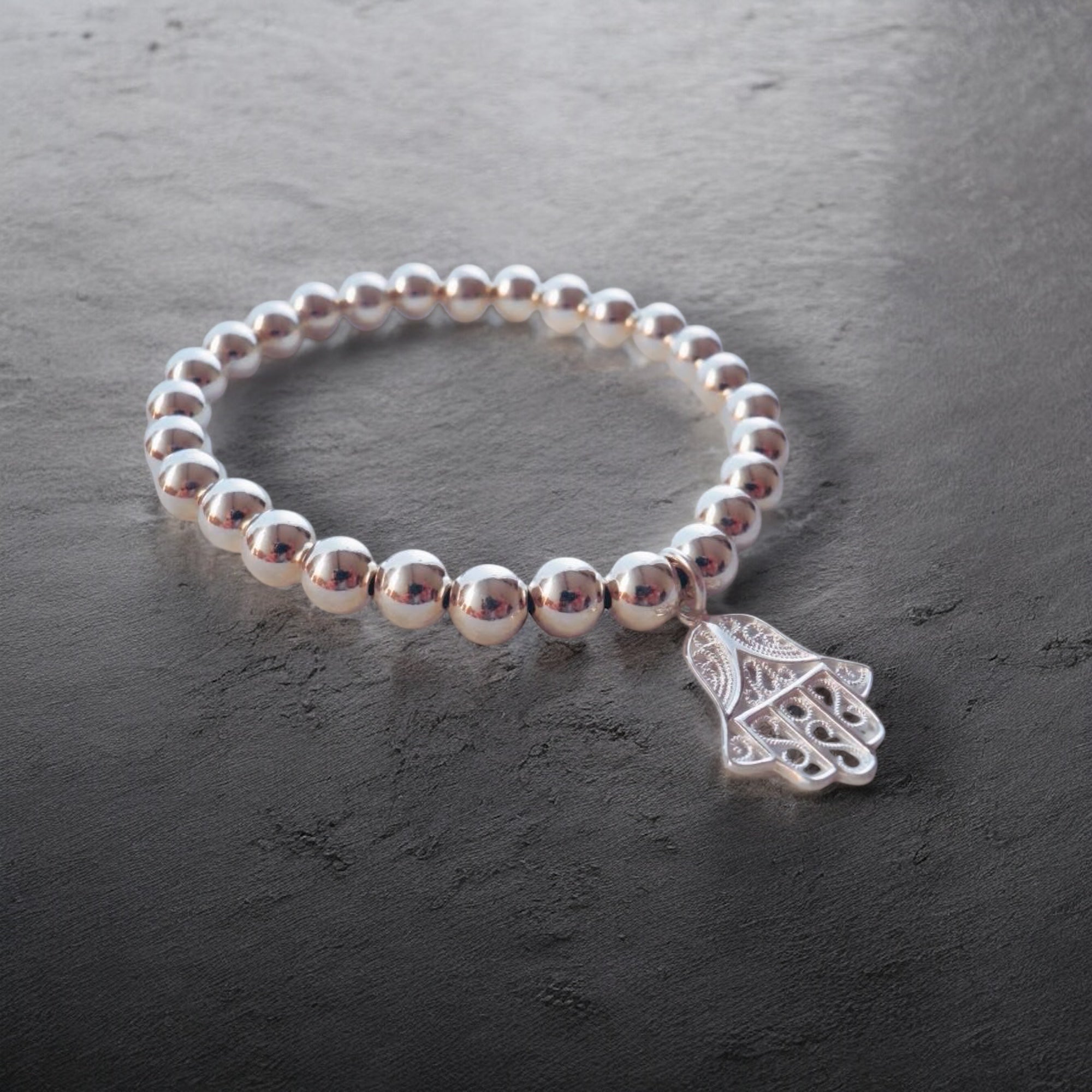 Elastisches 925 Silber Kugel Armband mit "Hand of Fatima" Anhänger