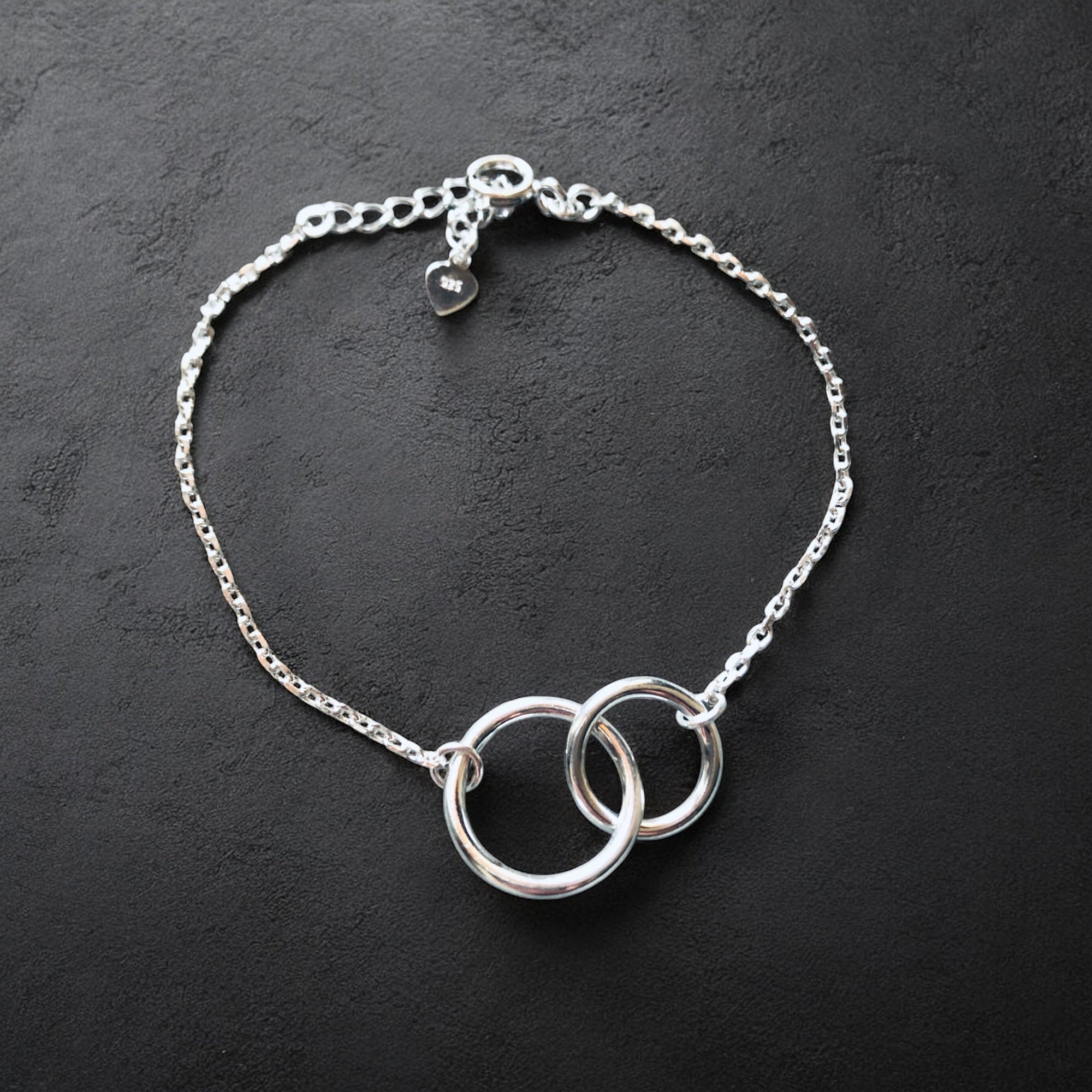 Armkette Silber mit verschlungenen Ringen