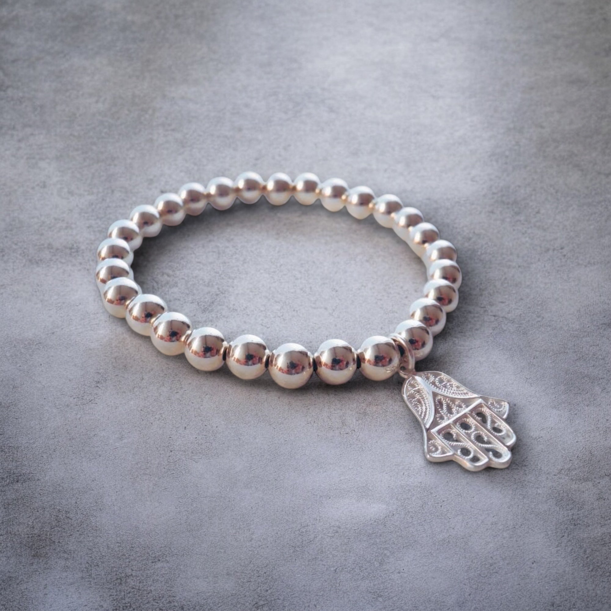 Elastisches 925 Silber Kugel Armband mit "Hand of Fatima" Anhänger